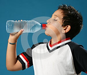 Thirsty boy drinking water