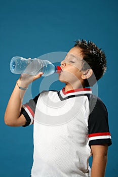 Thirsty boy drinking water