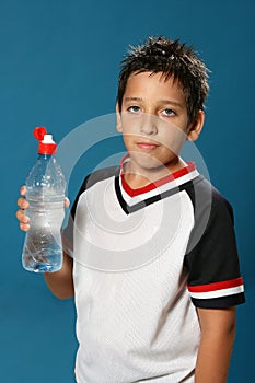 Thirsty boy drinking water