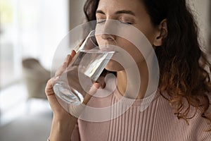 Thirsty Latin woman drink clean cold water