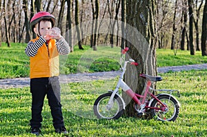 Thirsty little boy drinking water