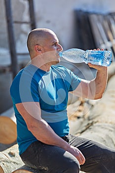 Thirsty lumberjack drinking water