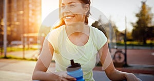 Thirsty sportswoman doing her jogging training