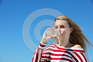 Thirsty woman drinking water