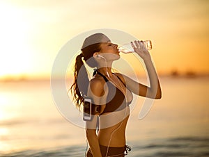 Thirsty woman drinking water