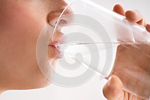 Thirsty Woman Drinking Water From Glass