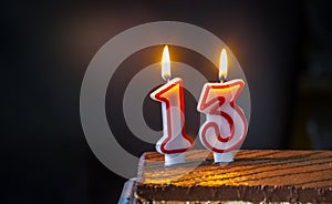 Thirteenth Birthday cake with candles photo