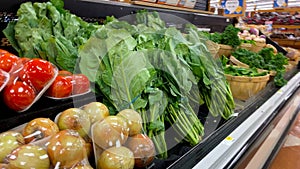 IGA retail grocery store interior collards on display photo