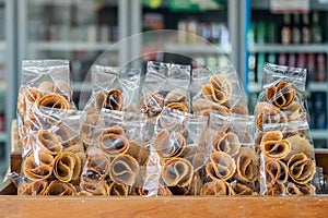 `Thong Muan` is a type of rolled wafer, a traditional dessert in plastic back packaging in local convenience store in Thailand