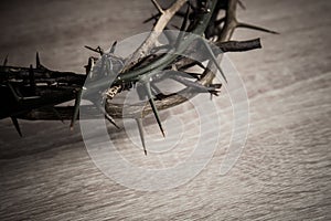 A thorn crown on a wooden table photo