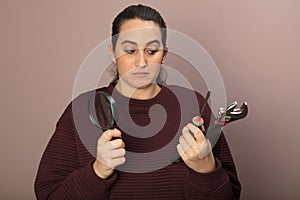 Thoughful woman with tools