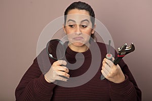 Thoughful woman with tools