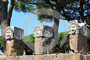 Decorative marble masks, Ostia Antica, Italy photo