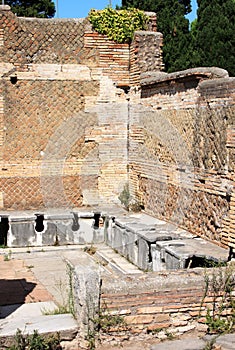 Ancient Roman latrines at Ostia Antica, Italy photo
