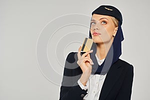 thoughtful arabian airlines stewardess in uniform