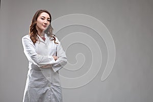 Thoughtful attractive woman doctor in a lab coat