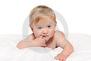 Thoughtful baby boy in the bed