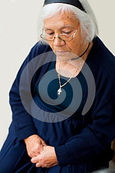 Thoughtful believer woman photo