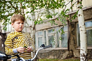 Thoughtful boy on a bike ride