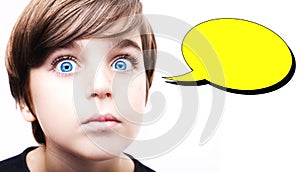 Thoughtful young boy with an empty thought bubble