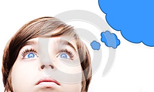 Thoughtful young boy with an empty thought bubble