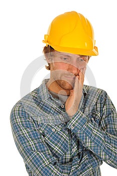 Thoughtful builder in hard hat