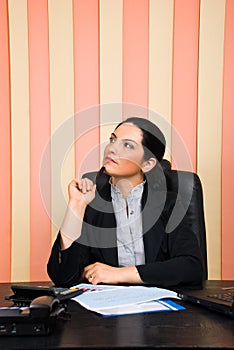 Thoughtful business woman looking away