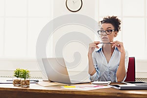 Thoughtful business woman at office