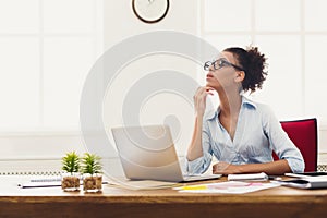 Thoughtful business woman at office