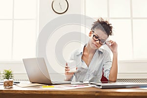 Thoughtful business woman at office