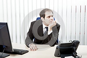 Thoughtful businessman in his office