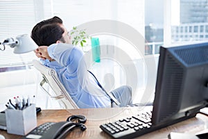 Thoughtful businessman at office desk