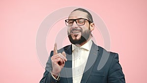 Thoughtful businessman with a plan, contemplating in pink room