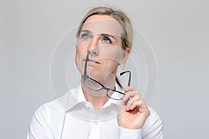 Thoughtful businesswoman with eyeglasses