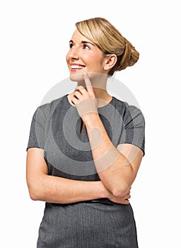 Thoughtful Businesswoman With Hand On Chin Smiling