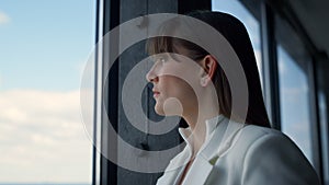 Thoughtful businesswoman looking window closeup. Successful ceo consider issues