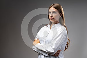 Thoughtful businesswoman portrait on a dark gray background