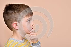 Thoughtful cute young boy