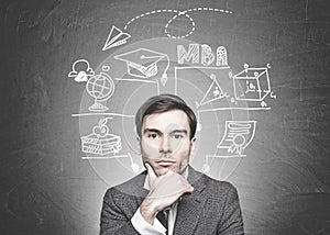 Thoughtful dark haired businessman, MBA education photo