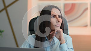Thoughtful doubtful Caucasian business woman working on laptop at office pensive puzzled businesswoman unsure girl