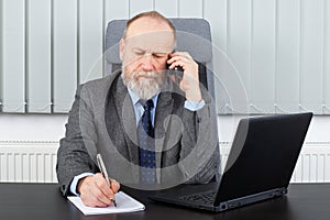 Thoughtful employer having a phone call