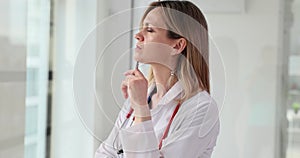 Thoughtful female doctor analyzes a medical diagnosis