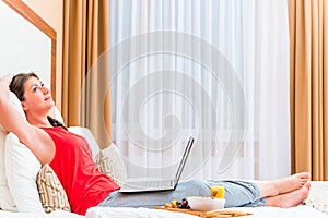 Thoughtful girl with a laptop