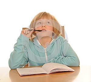 Thoughtful girl sitting at desk