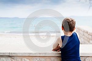 Thoughtful little boy on summer vacations