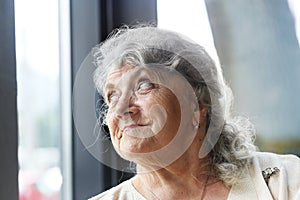 Thoughtful and looking grandmother face