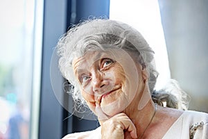 Thoughtful and looking grandmother face