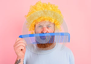 Thoughtful man with beard, yellow peruke and big comb