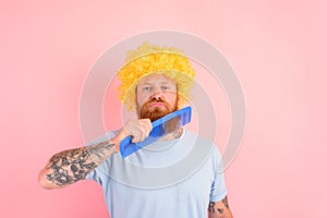 Thoughtful man with beard, yellow peruke and big comb