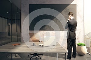 Thoughtful man and chalkboard